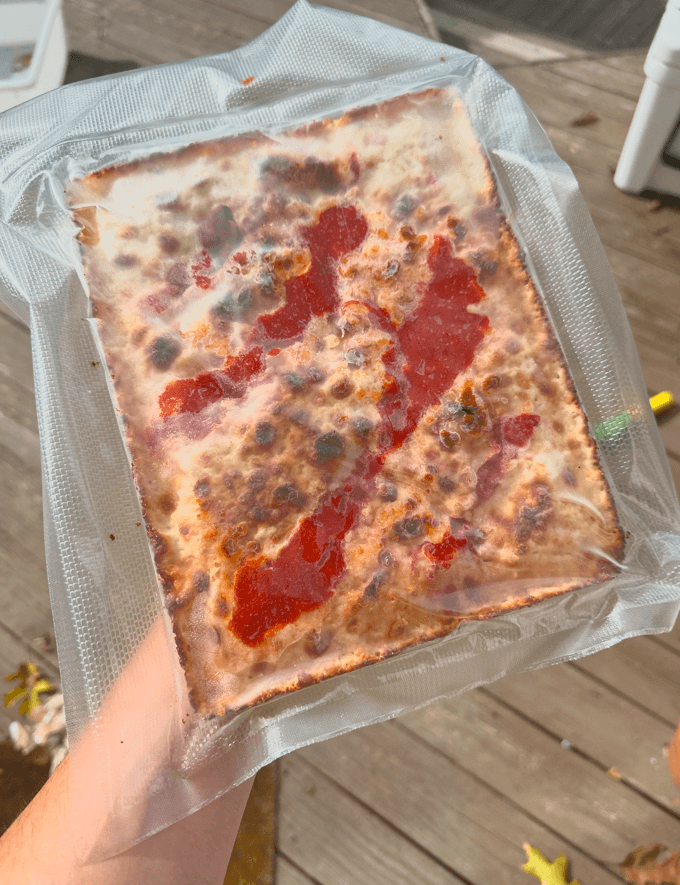 Vacuum-sealed frozen pan pizzas, take & bake